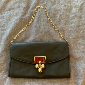 Black clutch with gold hardware
